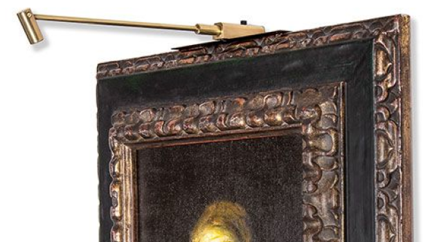 Detailed close-up of framed artwork with LED picture light